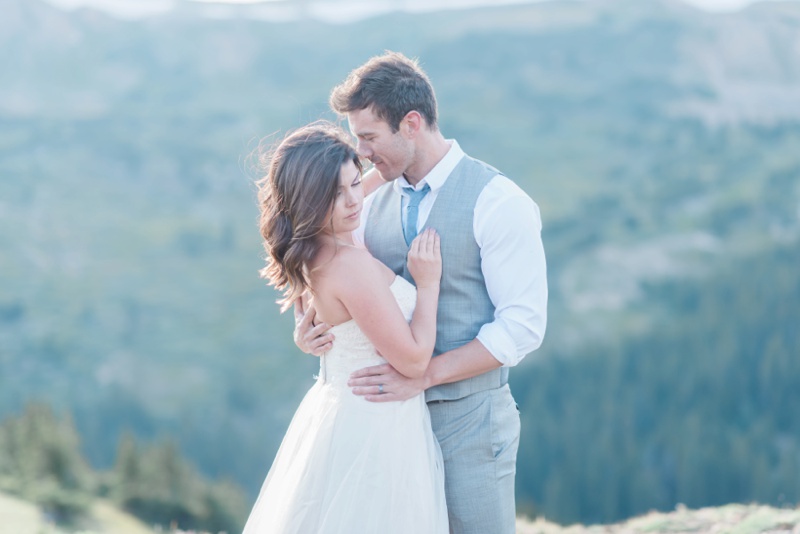 Intimate wedding bride and groom mountain top portrait