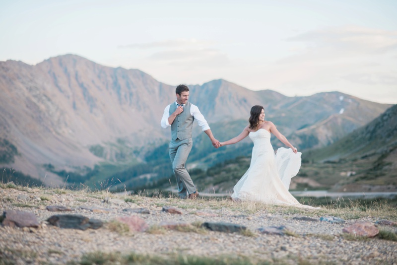 Loveland pass wedding bride and groom walk into their forever 