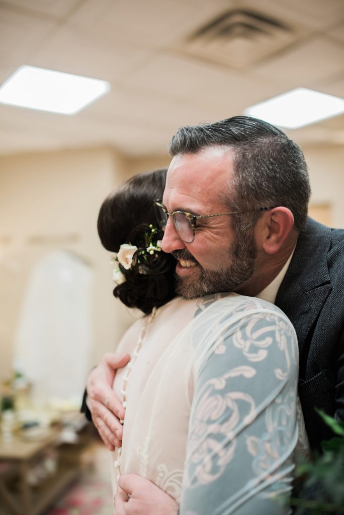 Father daughter first look for indoor winter wedding 