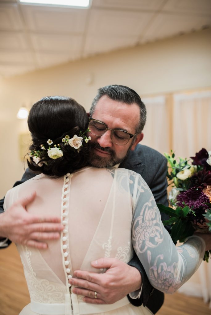Father daughter first look for indoor winter wedding 