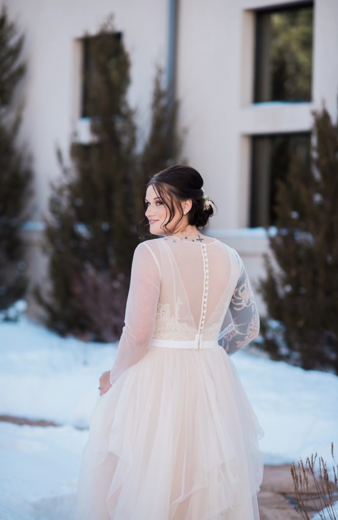 First look during snowy winter wedding Colorado Black Forest