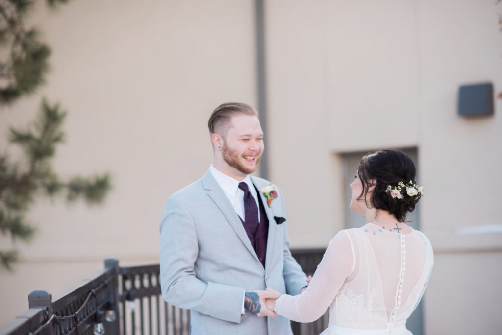 overjoyed groom during first look with his bride