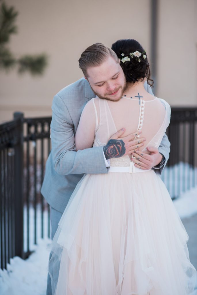 teary eyed groom stunned by bride's beauty during first look in Colorado 