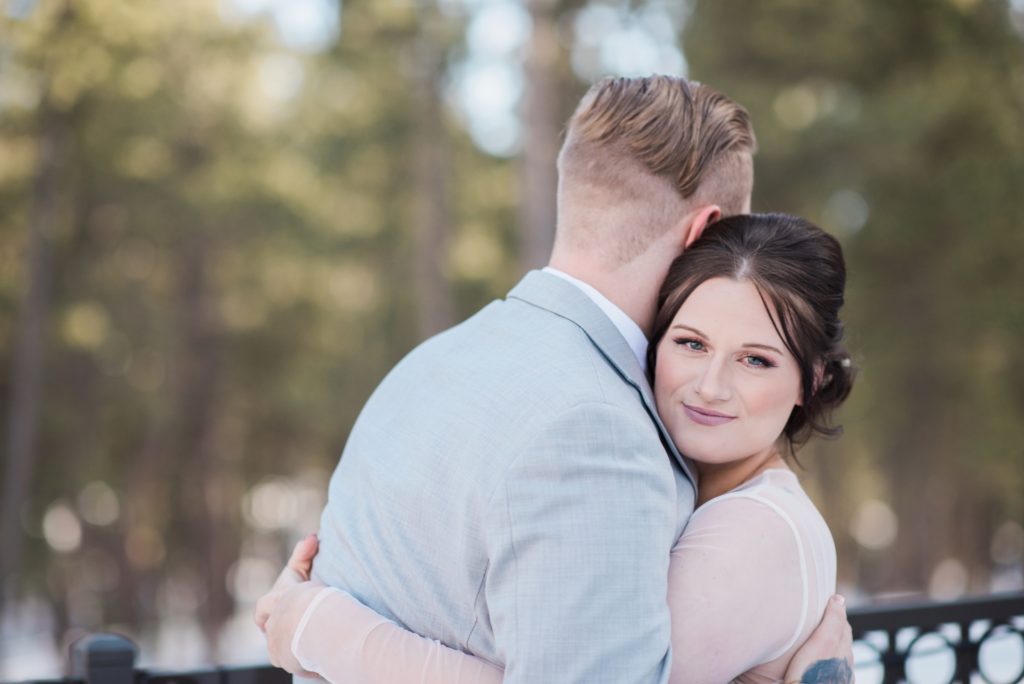 Couple embracing during first look at Black Forest by Wedgewood Weddings 