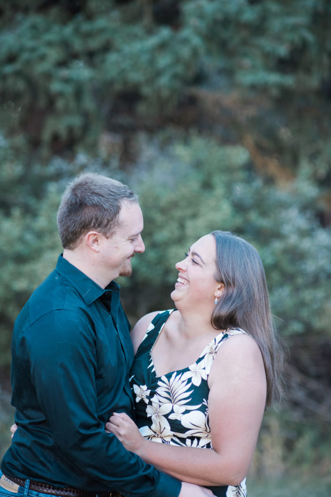 joyful bride to be with fiancé in fall engagement pictures with Jenna Wren Photography