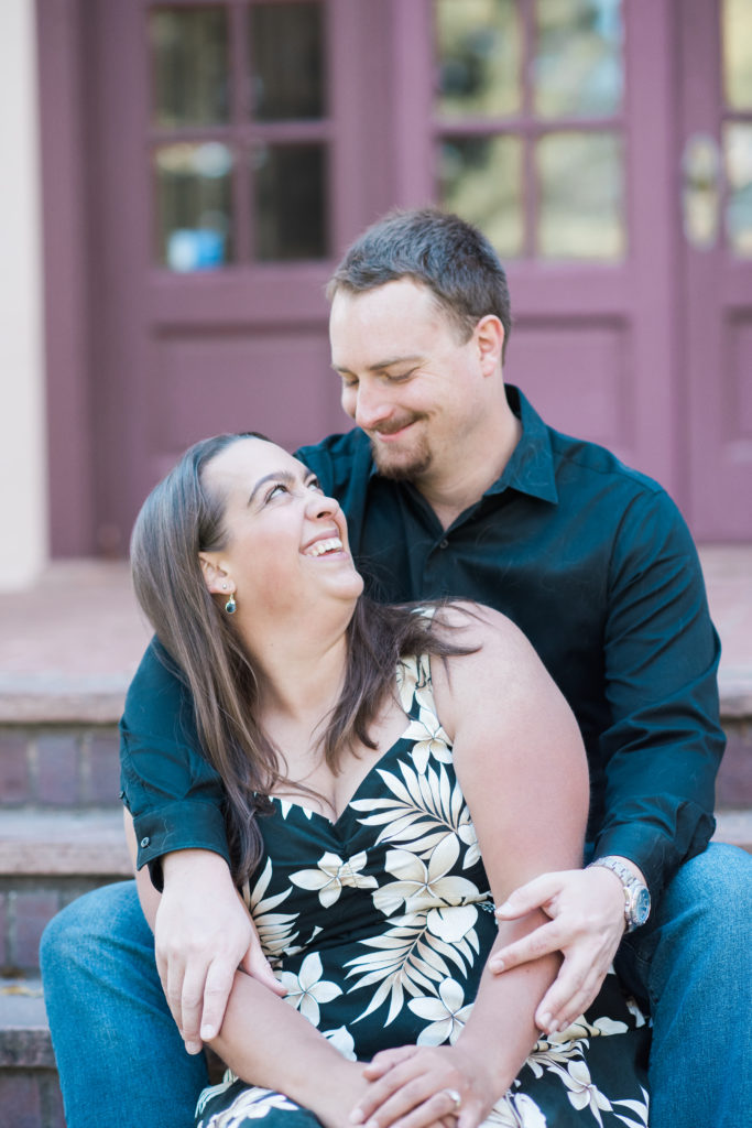 huge smiles celebrating their engagement together in fall portraits