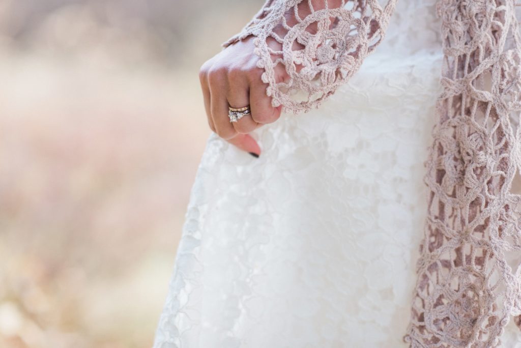 Ring and wedding gown details during fall wedding in Colorado