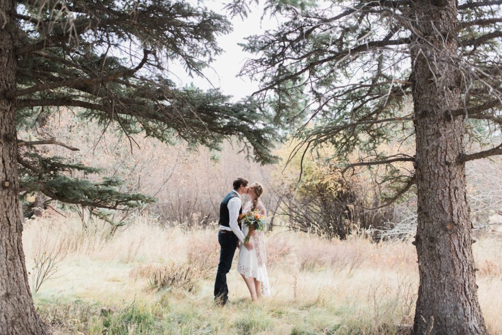 Couple kissing after wedding ceremony in Estes Park, Colorado