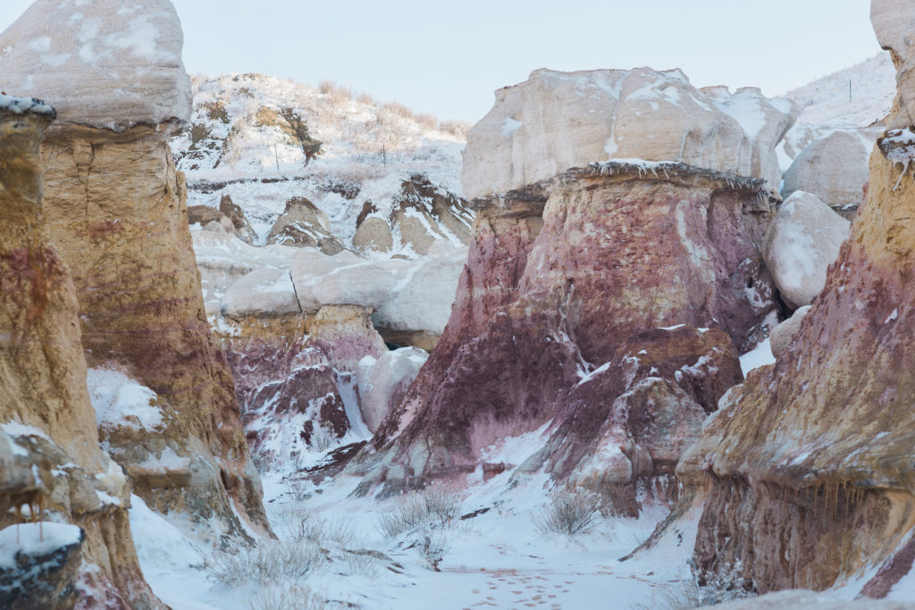 Pink and Orange hues of the canyon walls at the Paint Mines in Colorado's eastern horizon