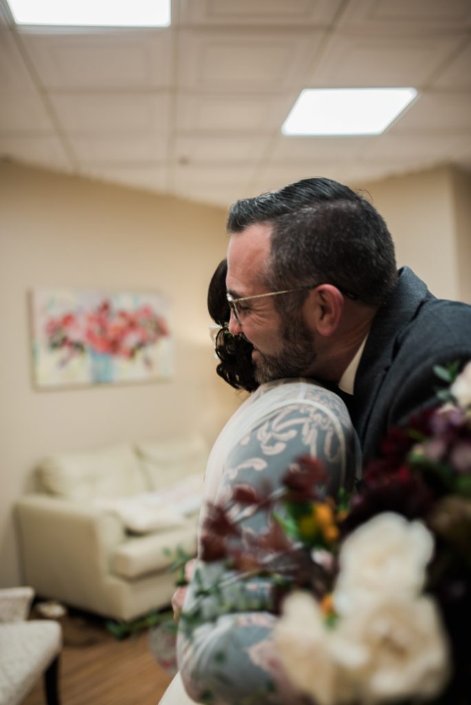 Father and Daughter hug during her bridal portraits Black Forest at Wedgewood Weddings
