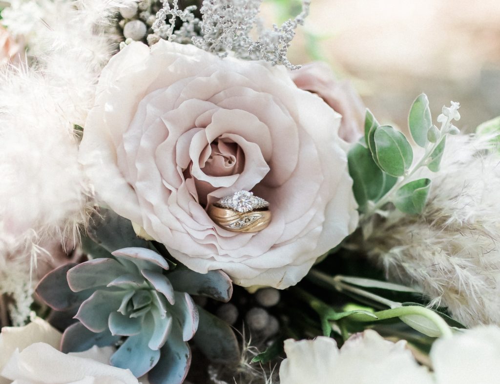 Dusty rose and succulent bouquet with ring shot 