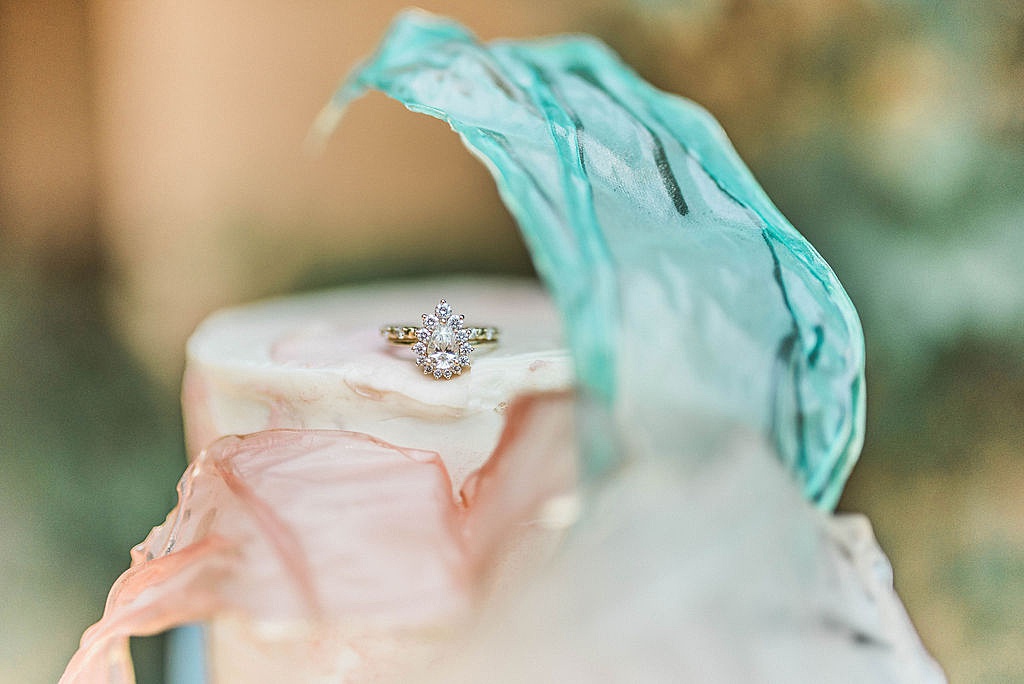 engagement ring by Sarah O. Jewelry with watercolor cake by Ruby Jean Patisserie
