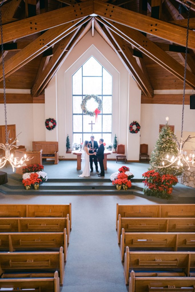 couple getting married inside chapel at beaver creek 