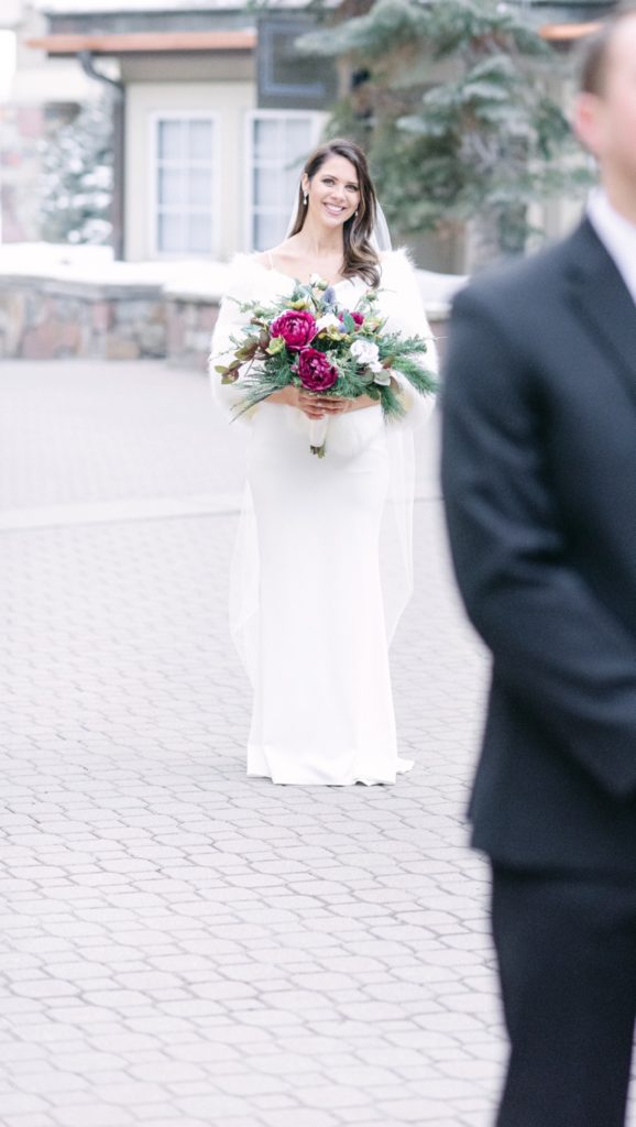 first look with couple at Park Hyatt Beaver Creek in winter wedding