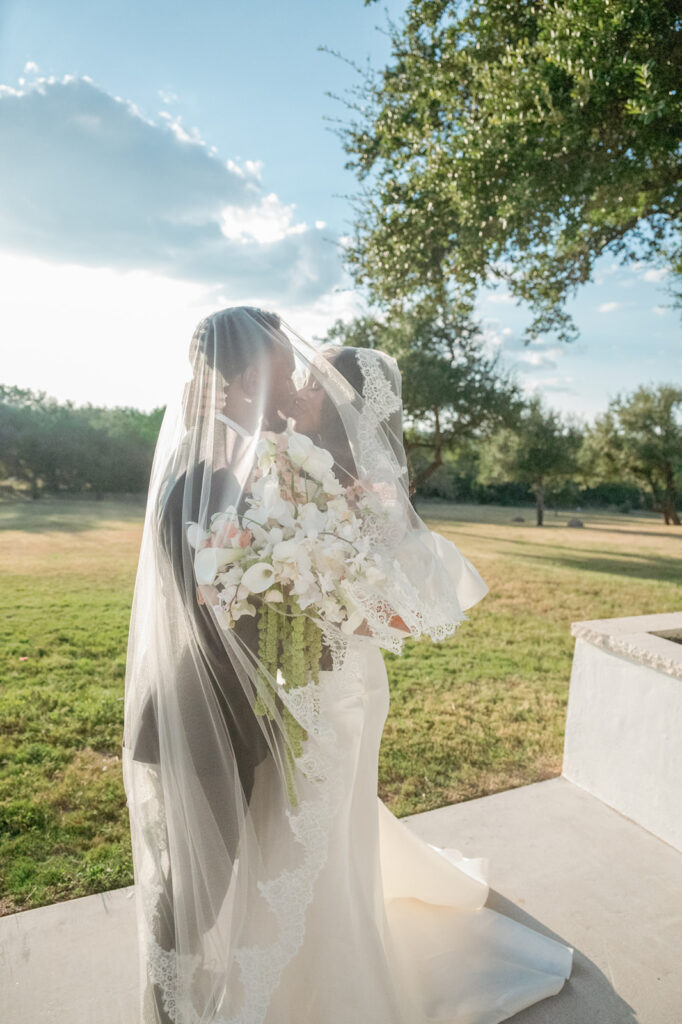 Editorial wedding portraits of bride and groom at The Arlo, framed by clean architecture and soft Texas hill country light.”