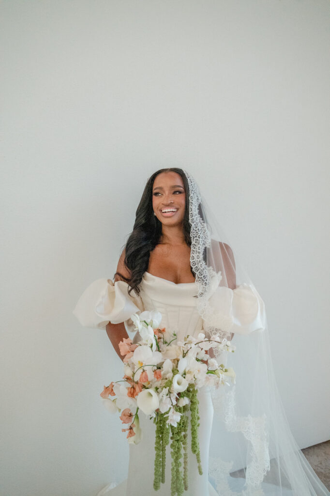 Editorial wedding portraits of bride and groom at The Arlo, framed by clean architecture and soft Texas hill country light.”