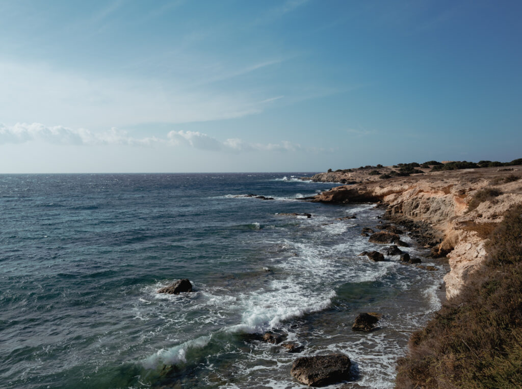 Coastal Sicily wedding inspiration featuring sun-worn stone, open sea, and Mediterranean light